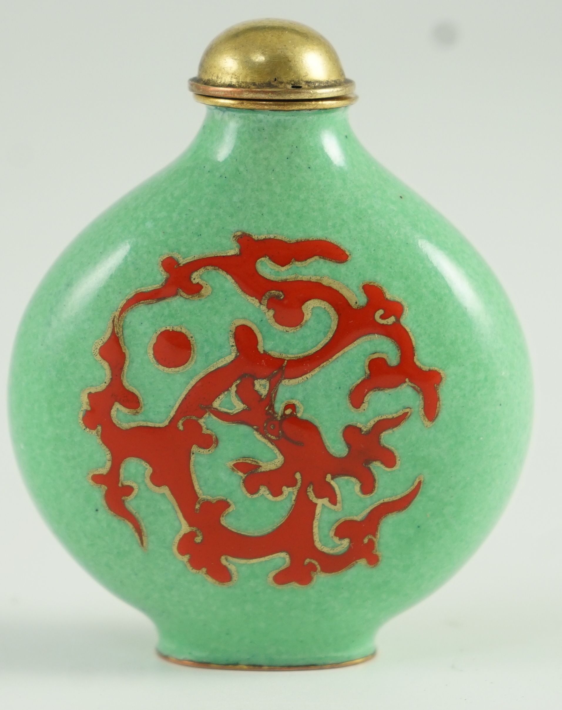 A Chinese enamel on copper green ground snuff bottle, 19th/20th century, 6.2 cm high including stopper